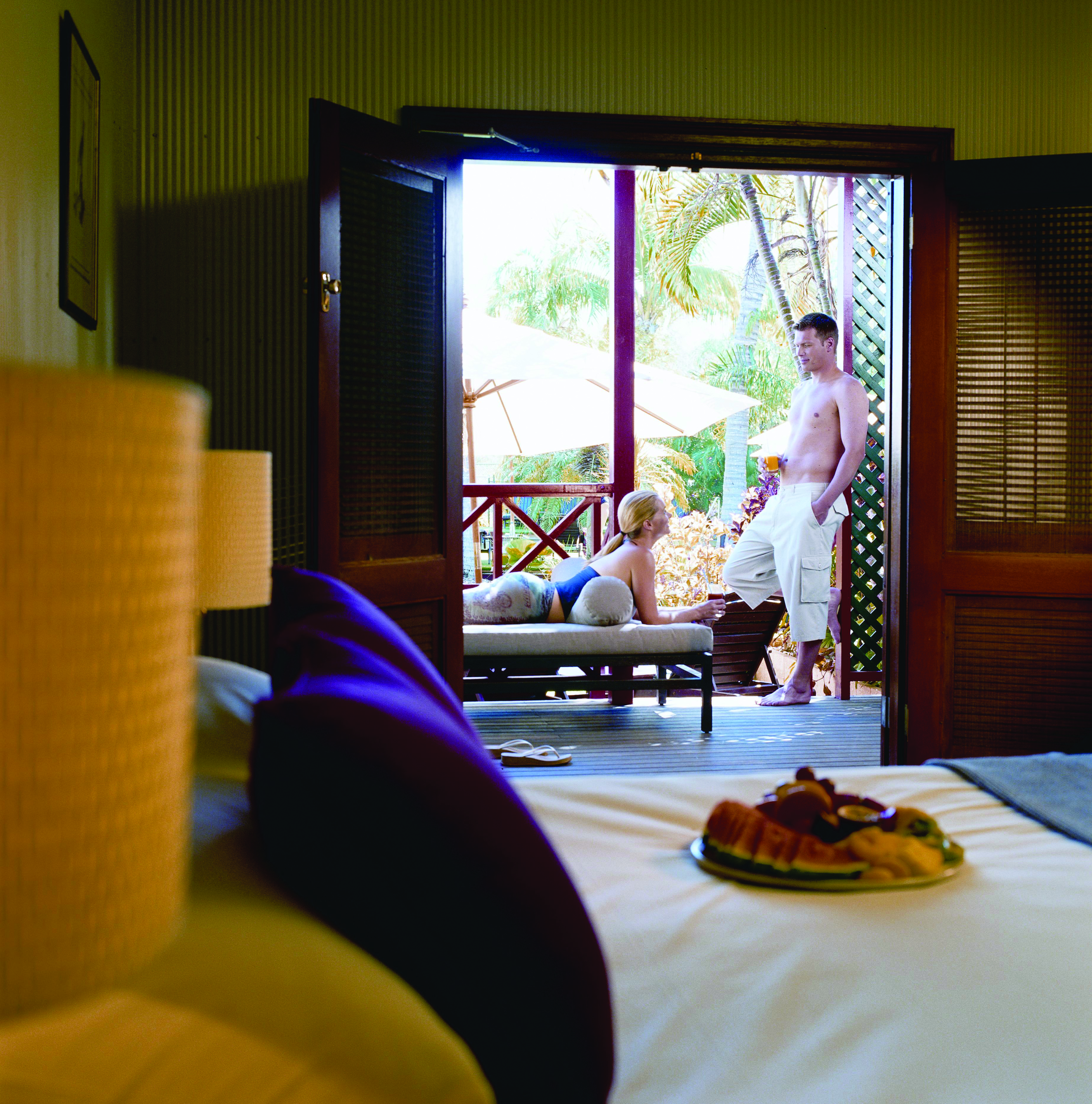 Port Douglas Peninsula Queensland private terrace  man and woman relaxing on a private terrace 