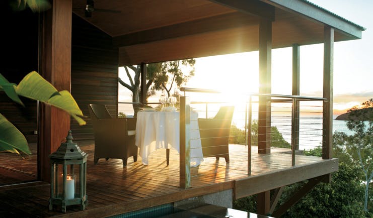 Qualia Hamilton Island Queensland outdoor dining area on covered deck with sea view