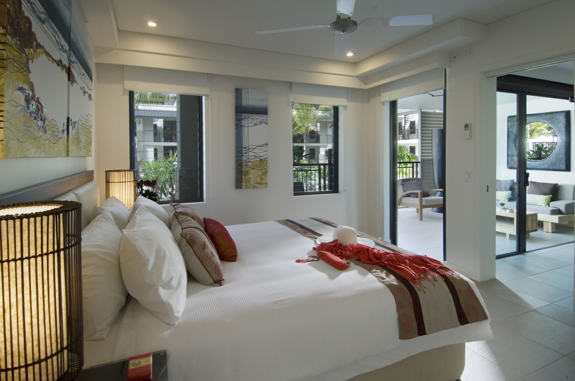 Sea Temple Queensland bedroom with artwork and view to sitting room