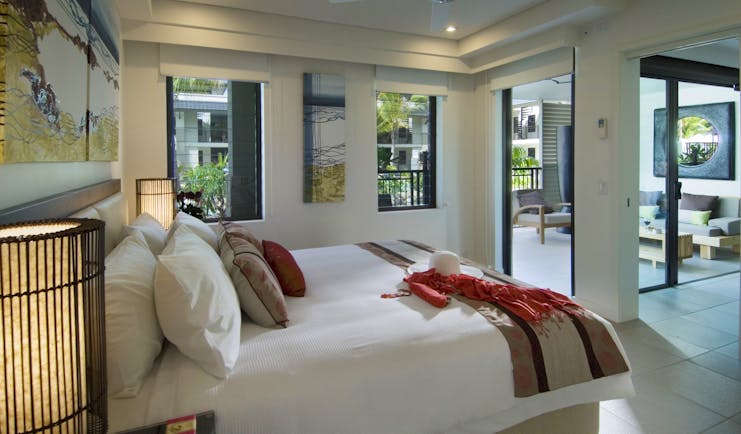 Sea Temple Queensland bedroom with artwork and view to sitting room