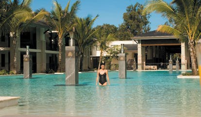 Sea Temple Queensland lagoon pool with columns and palm plants