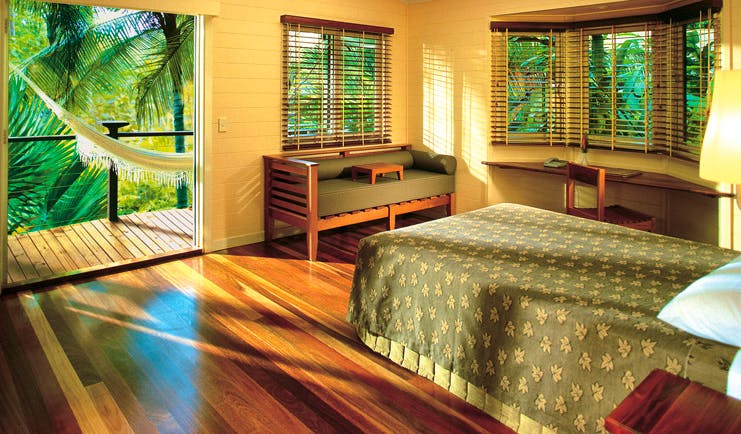 Silky Oaks Lodge Queensland bedroom with door to balcony with hammock