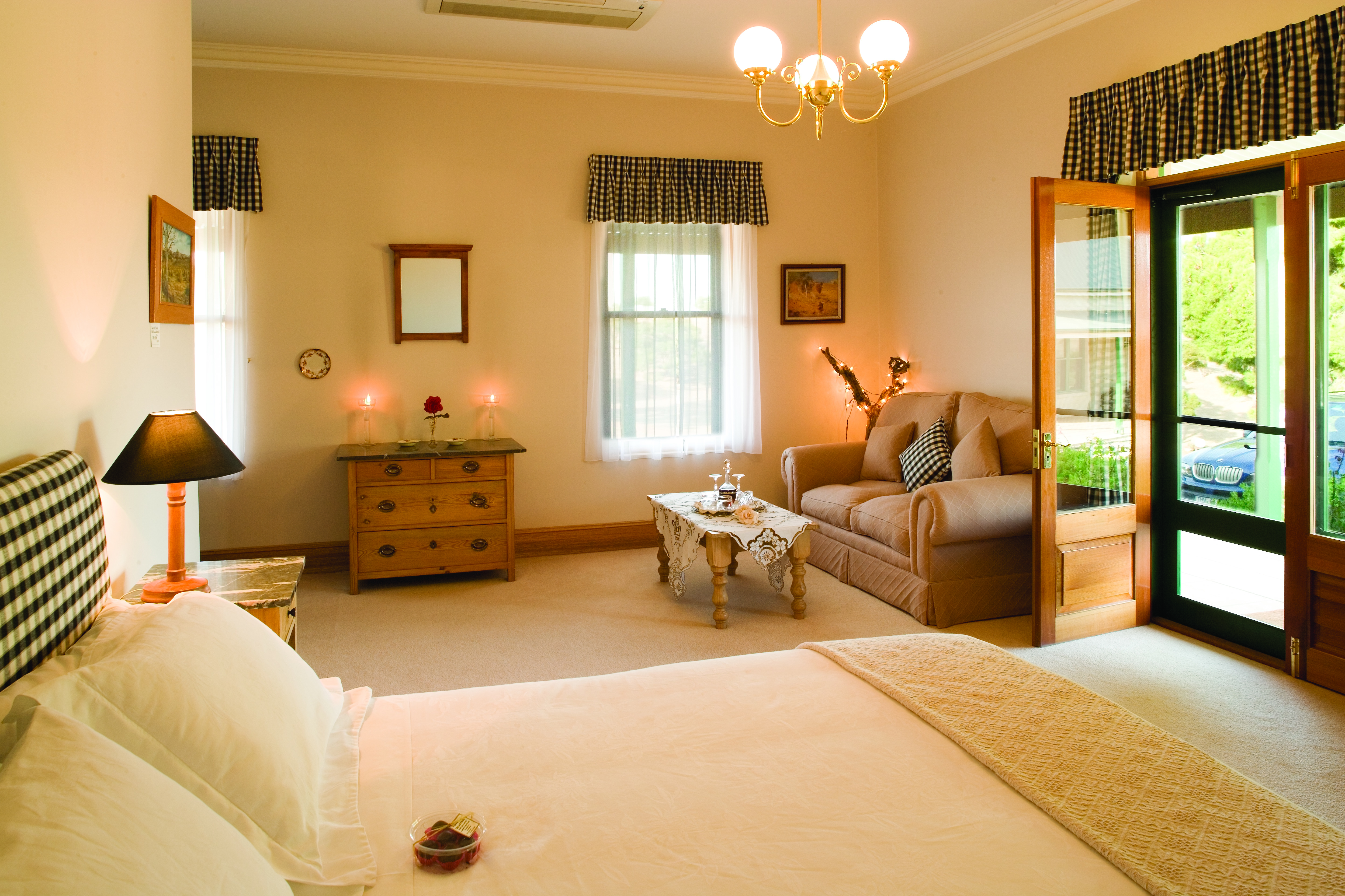 Abbotsford Country House South Australia bedroom with sofa and doors to porch