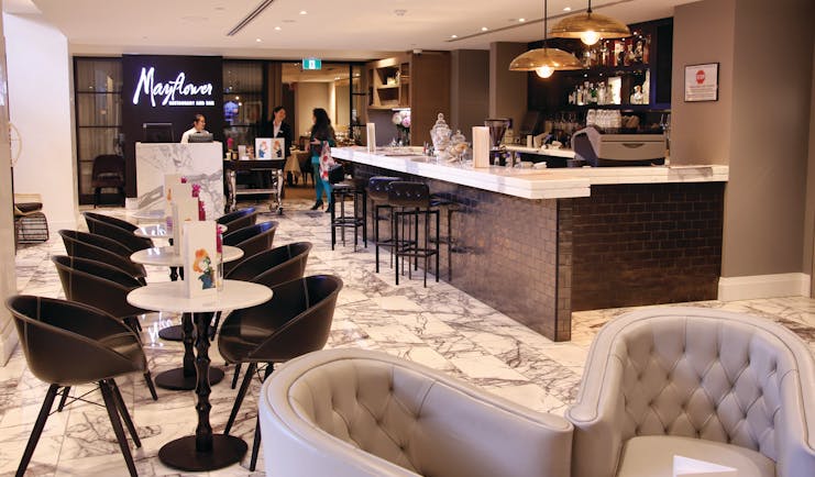 Mayfair Hotel Adelaide Mayflower restaurant dining area with marble floor and black tiled bar area