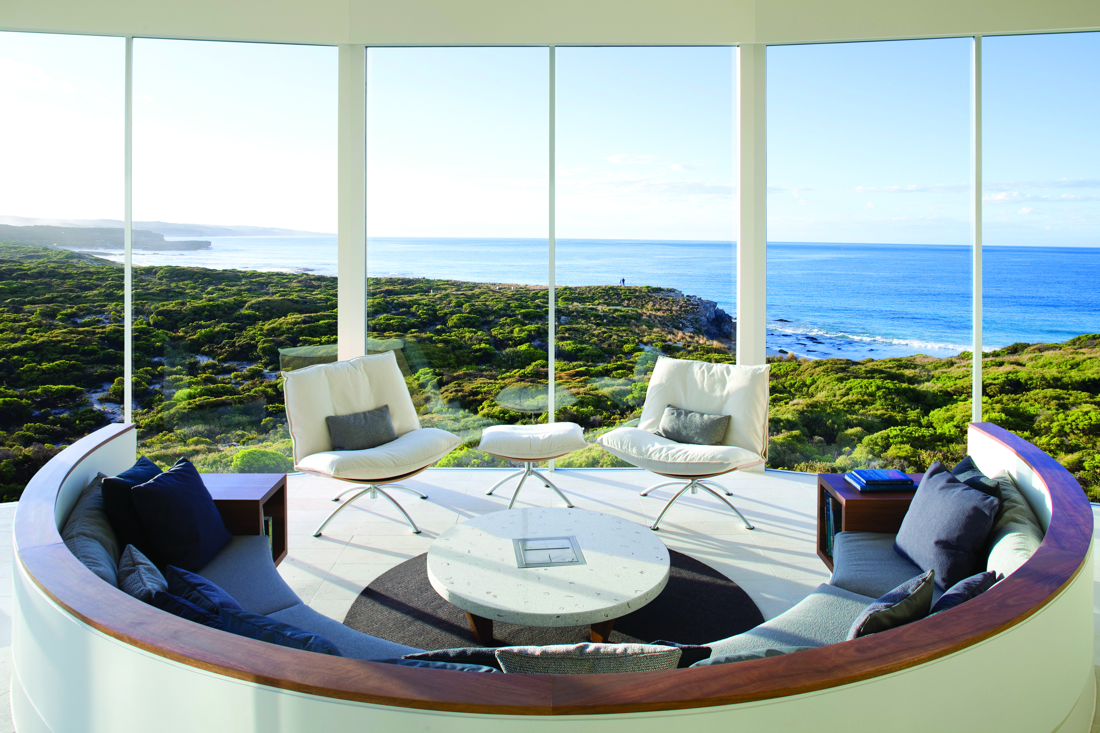 Southern Ocean Lodge osprey pavilion lounge, modern seating area with panoramic views over coastline and sea