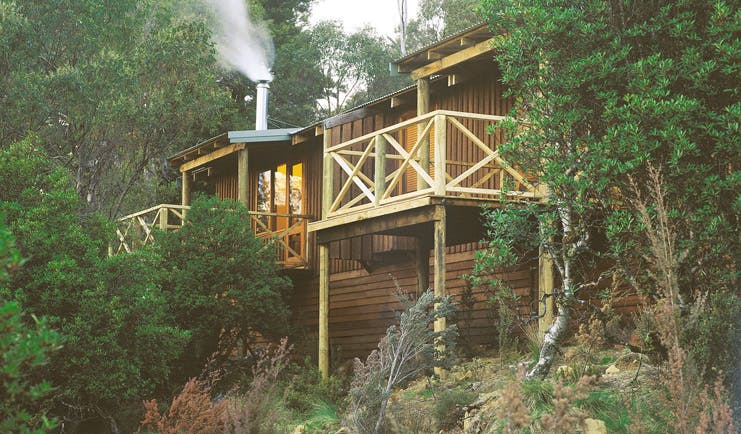 Cradle Mountain Lodge Tasmania cabin balcony two wood cabins with balconies in the forest