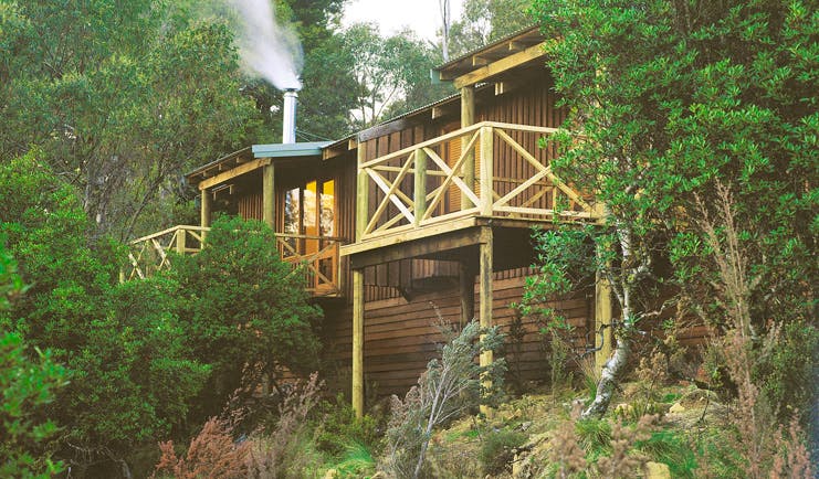 Cradle Mountain Lodge Tasmania cabin balcony two wood cabins with balconies in the forest