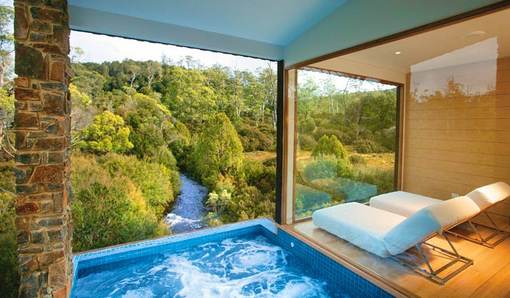 Cradle Mountain Lodge Tasmania pool view private swimming pool with view of river and loungers