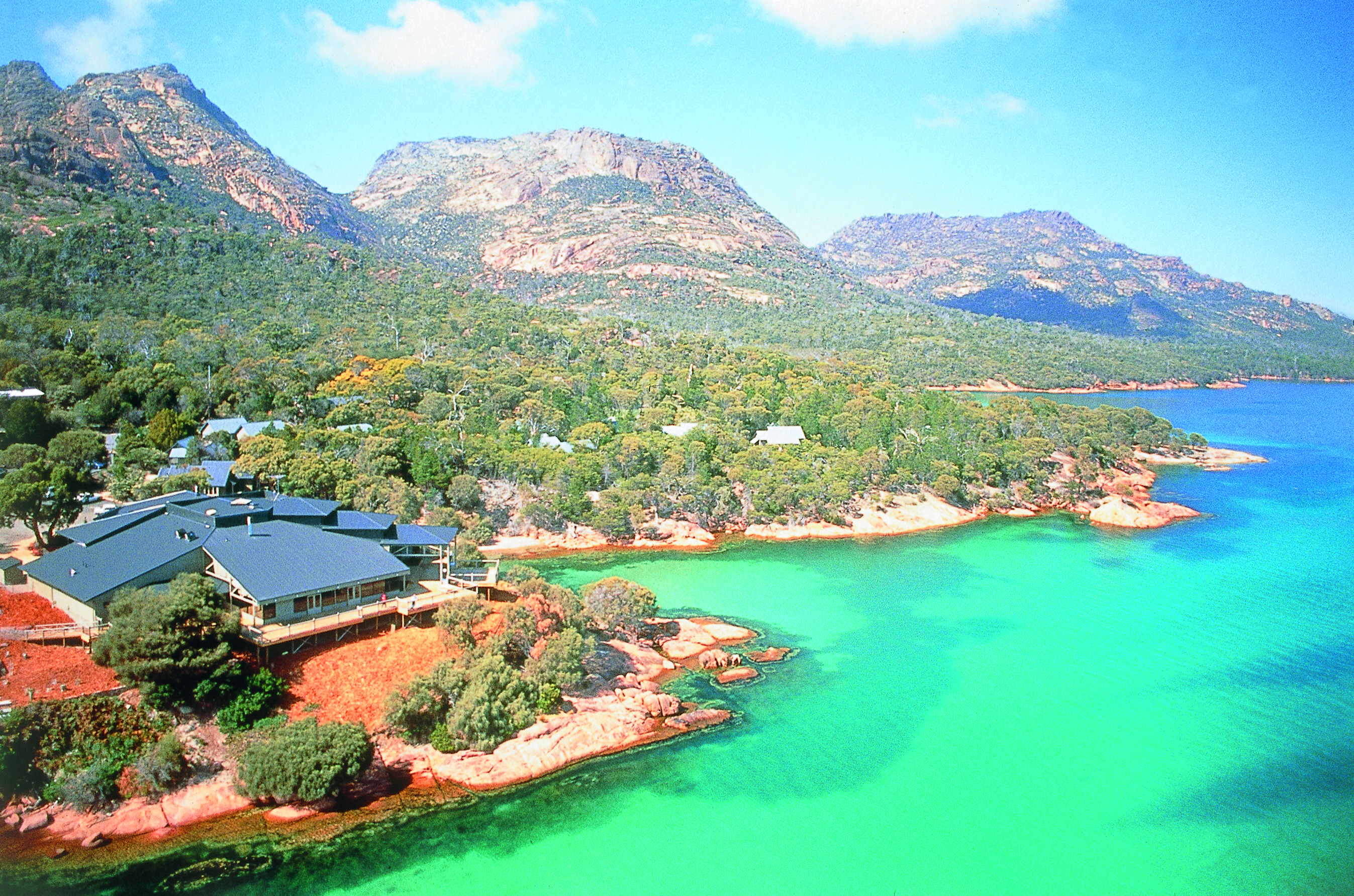 Aerival view over Freycinet Lodge shown near the sea and mountains