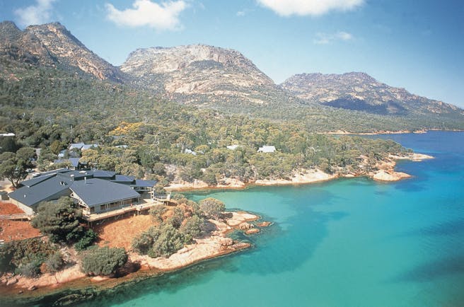 Aerival view over Freycinet Lodge shown near the sea and mountains