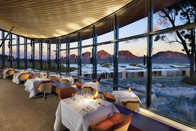 Saffire Freycinet Tasmania dining restaurant with floor to ceiling windows and mountain view