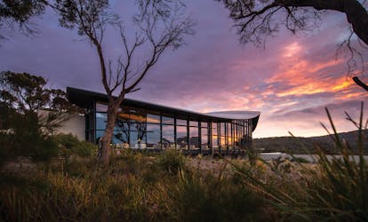 Saffire Freycinet Tasmania exterior sunrise view of futuristic building with large windows