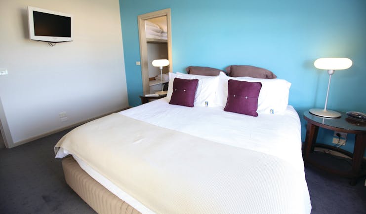 Chocolate Gannets Victoria and Melbourne bedroom with blue walls and television