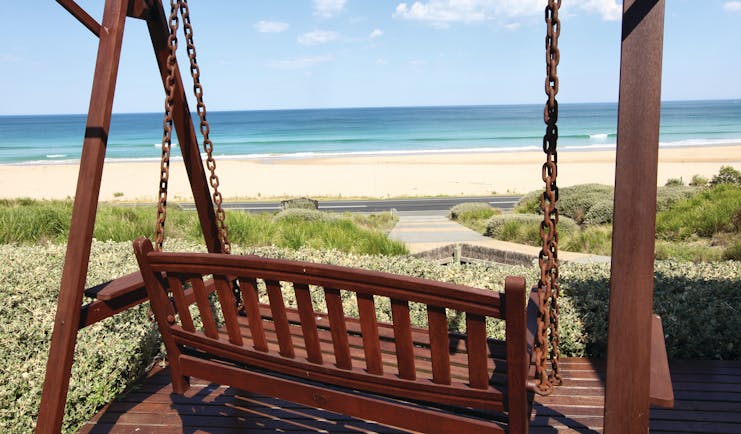 Chocolate Gannets Victoria and Melbourne exterior wooden love seat swing overlooking beach 