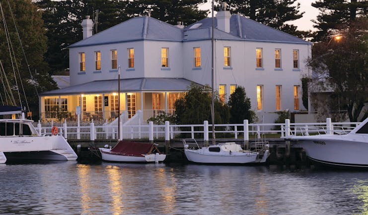 Oscars Waterfront Boutique Hotel Victoria and Melbourne exterior white building with covered porch next to marina