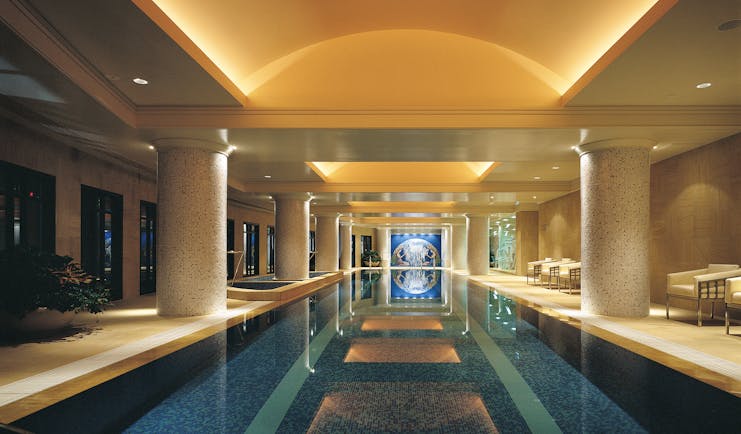 Park Hyatt Melbourne indoor swimming pool with columns and loungers