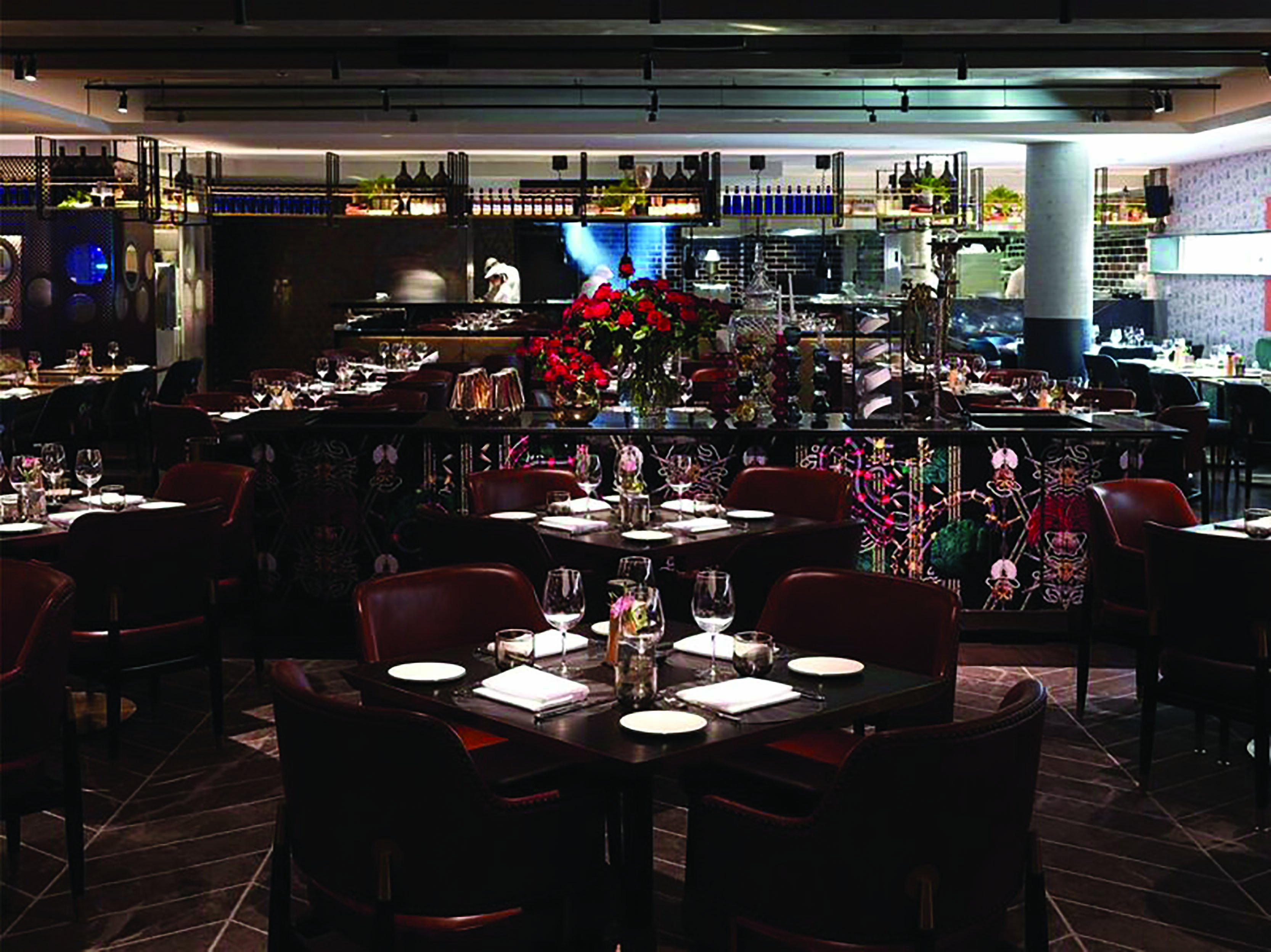 QT Melbourne restaurant indoor dining area, tables and chairs, dark wooden decor