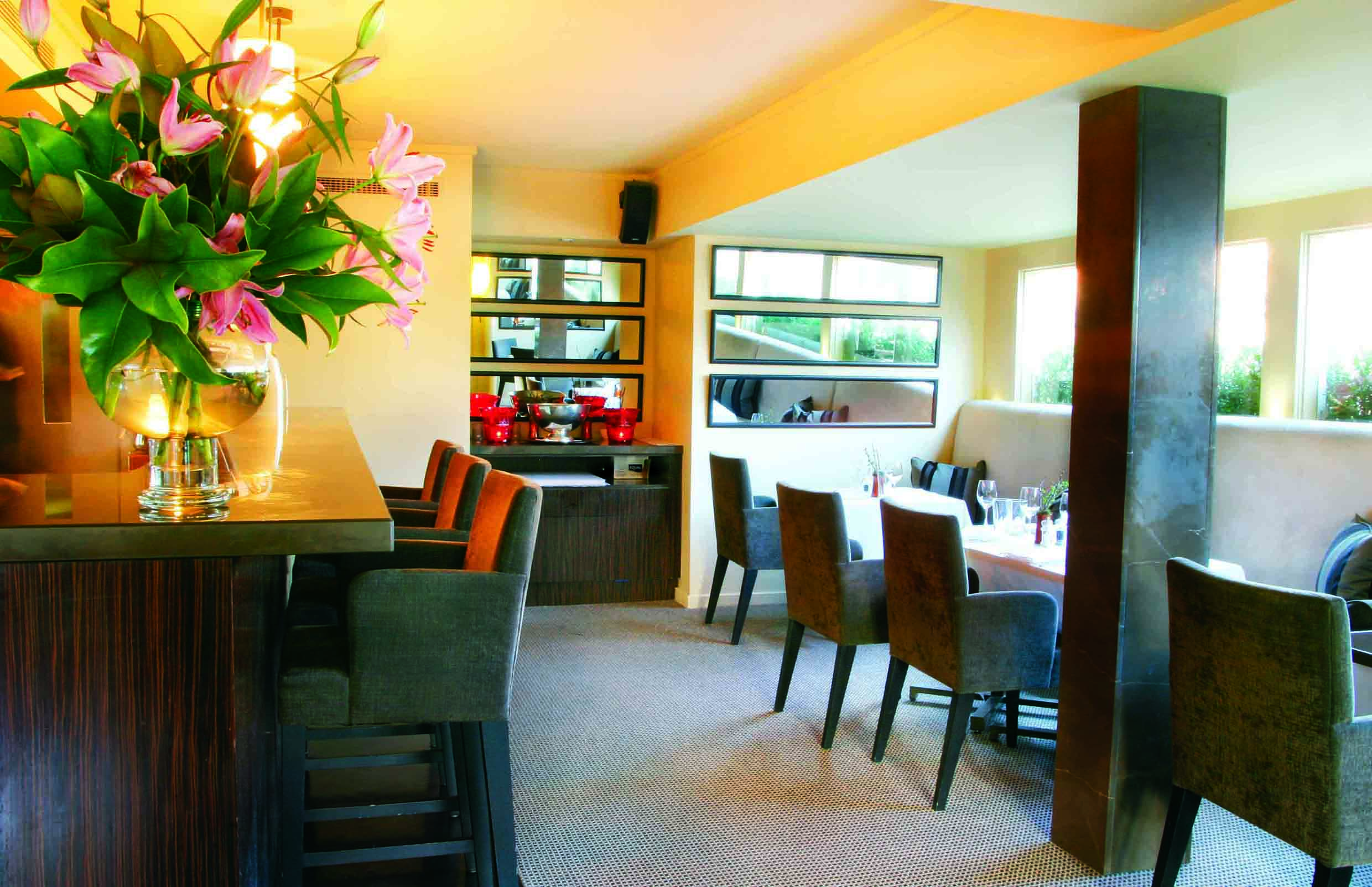 The Lyall Hotel Melbourne bistro bar restaurant and bar area with large windows and mirrors