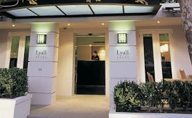 The Lyall Hotel Melbourne exterior white building entrance with signs reading 'The Lyall Hotel'