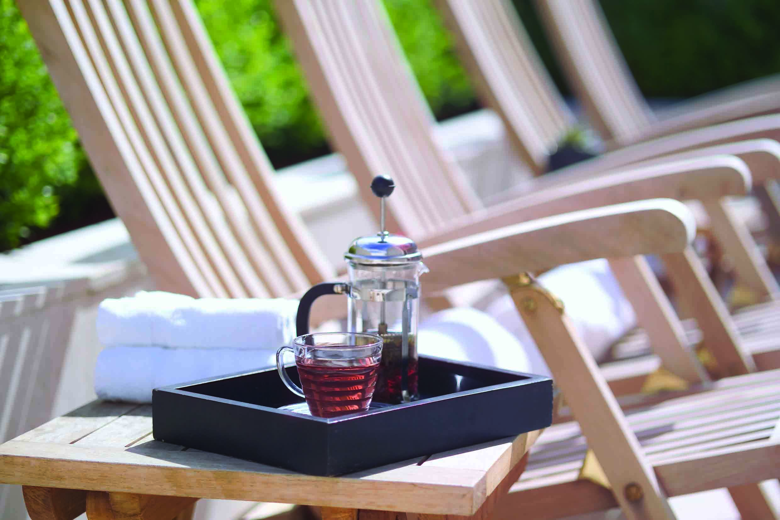 The Lyall Hotel Melbourne terrace lounger sun lounger with tea 