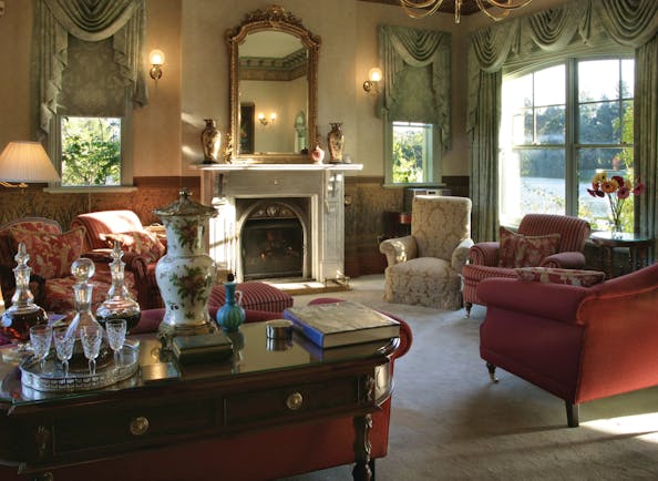 Woodman Estate Victoria drawing room with armchairs antiques fireplace and large bay window