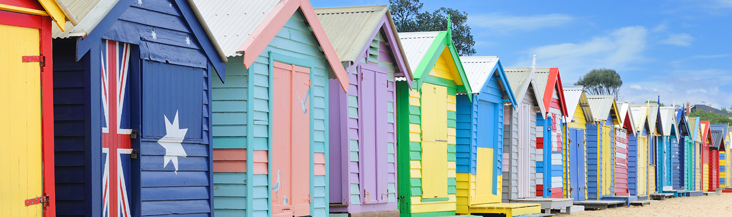 Multi coloured beach huts in a row on Brighton Beach Melbourne