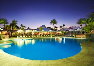 Cable Beach Club family pool, sun loungers umbrellas palm trees