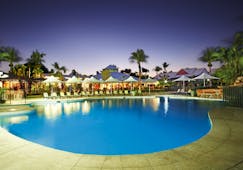 Cable Beach Club family pool, sun loungers umbrellas palm trees