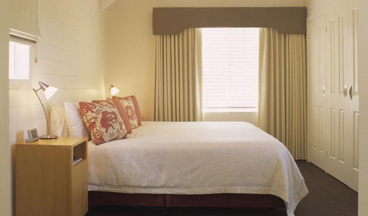 Cape Lodge Western Australia bedroom with bedside tables and wardrobe