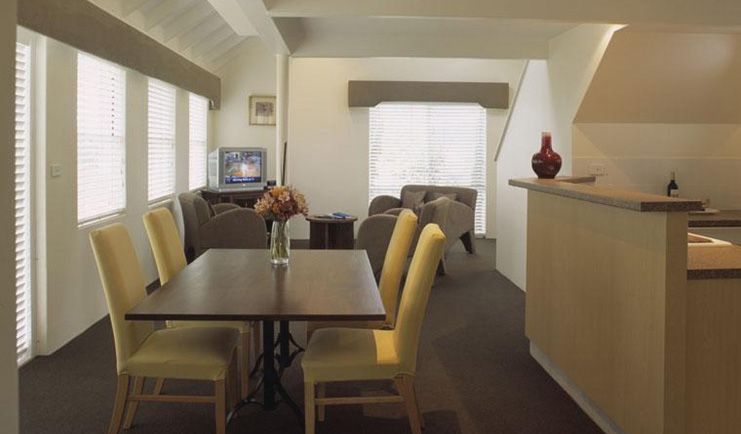 Cape Lodge Western Australia living room with sofa and dining table