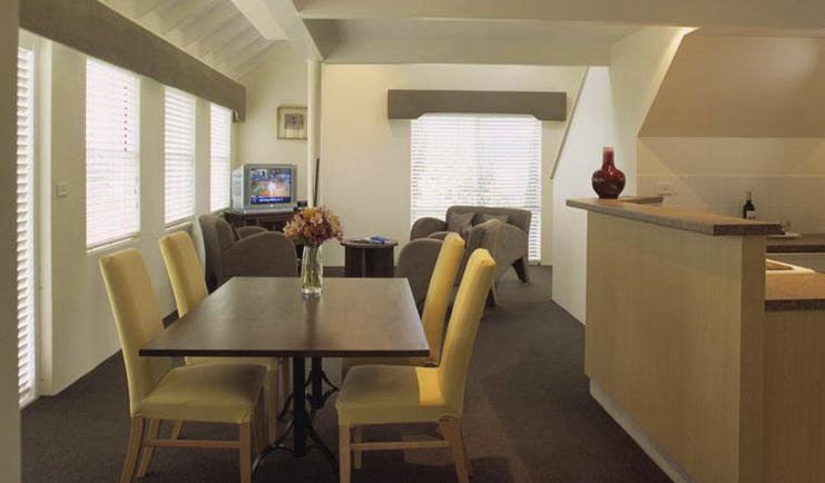 Cape Lodge Western Australia living room with sofa and dining table