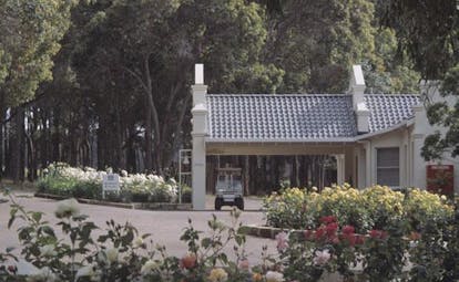 Cape Lodge Western Australia lodge exterior view of lodge with golf cart
