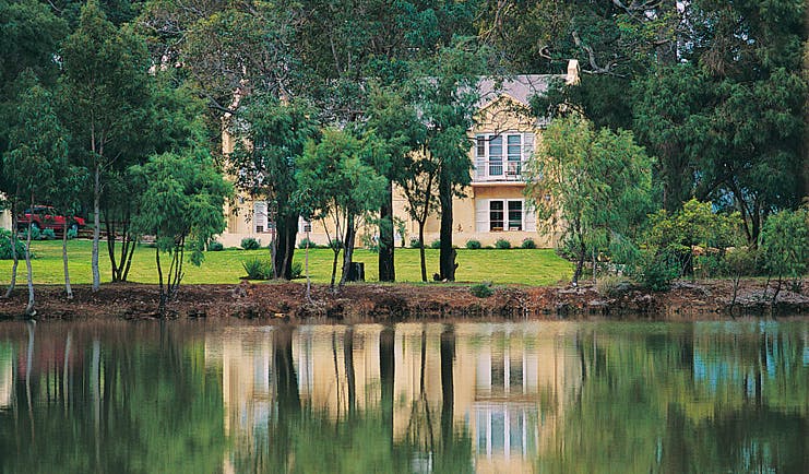 Cape Lodge Western Australia terrace suites view yellow building overlooking trees and a creek