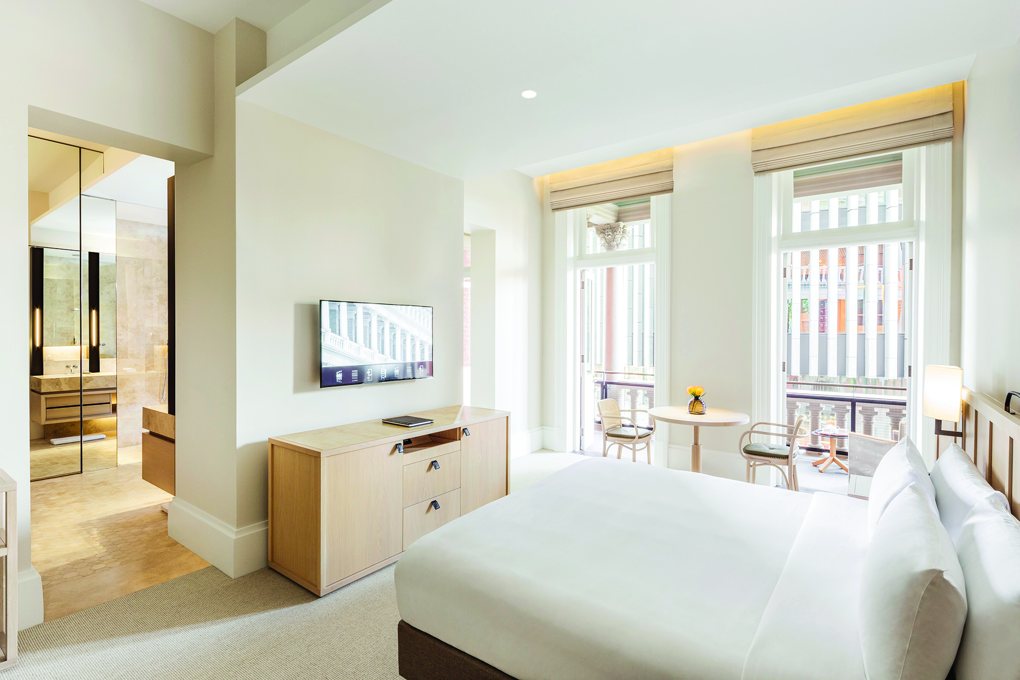 COMO The Treasury balcony bedroom, double bed, chairs, en suite bathroom, access to private balcony