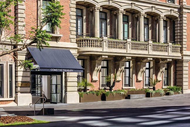 COMO The Treasury exterior, hotel building on roadside, windows, entrance