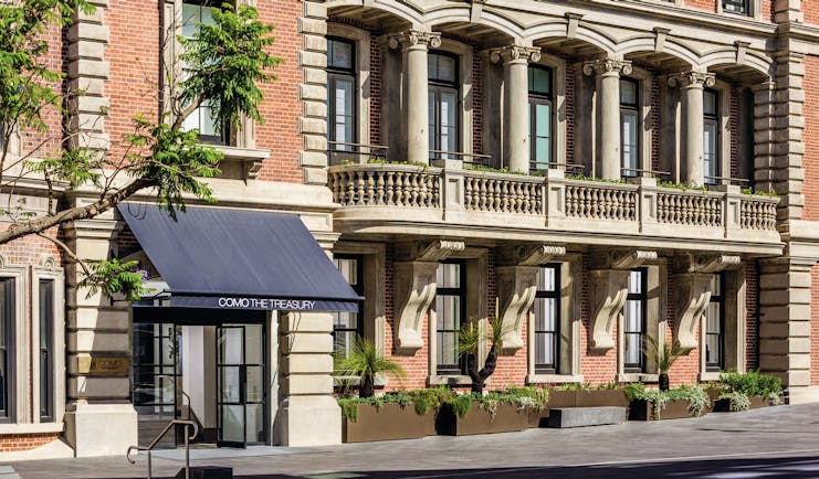 COMO The Treasury exterior, hotel building on roadside, windows, entrance