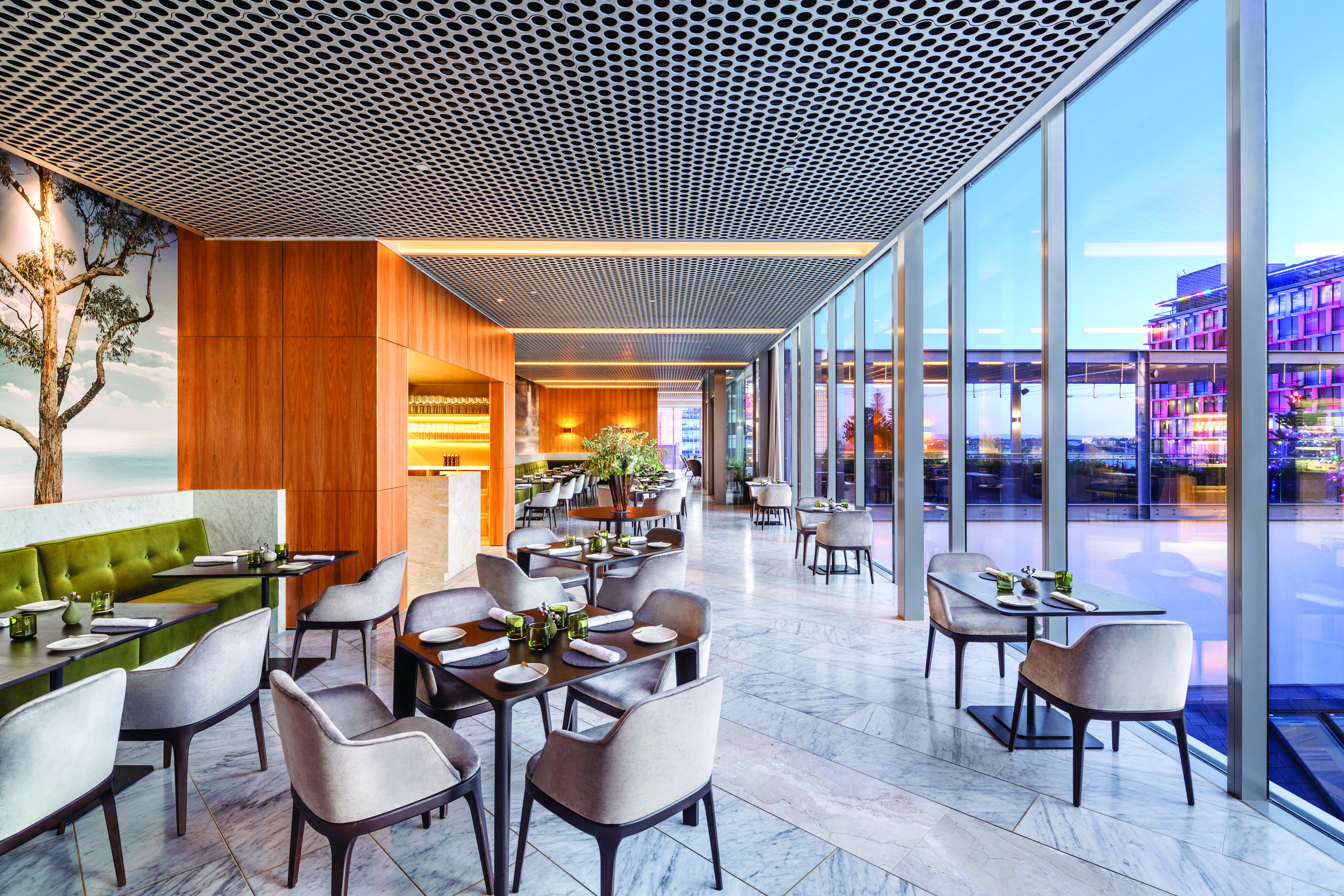 COMO the Treasury restaurant, indoor dining area with panoramic windows with cityscape views, velvet chairs, elegant decor