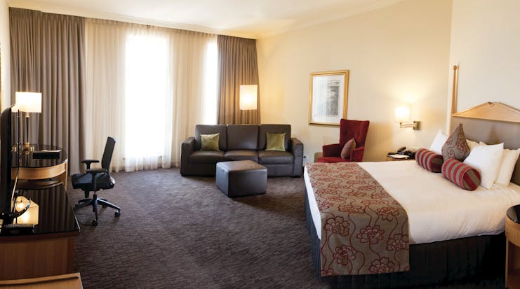 Duxton Hotel Western Australia and Perth club king bedroom with sofa and desk