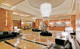 Duxton Hotel Western Australia and Perth lobby area with glass chandelier marble floor and metal sculpture
