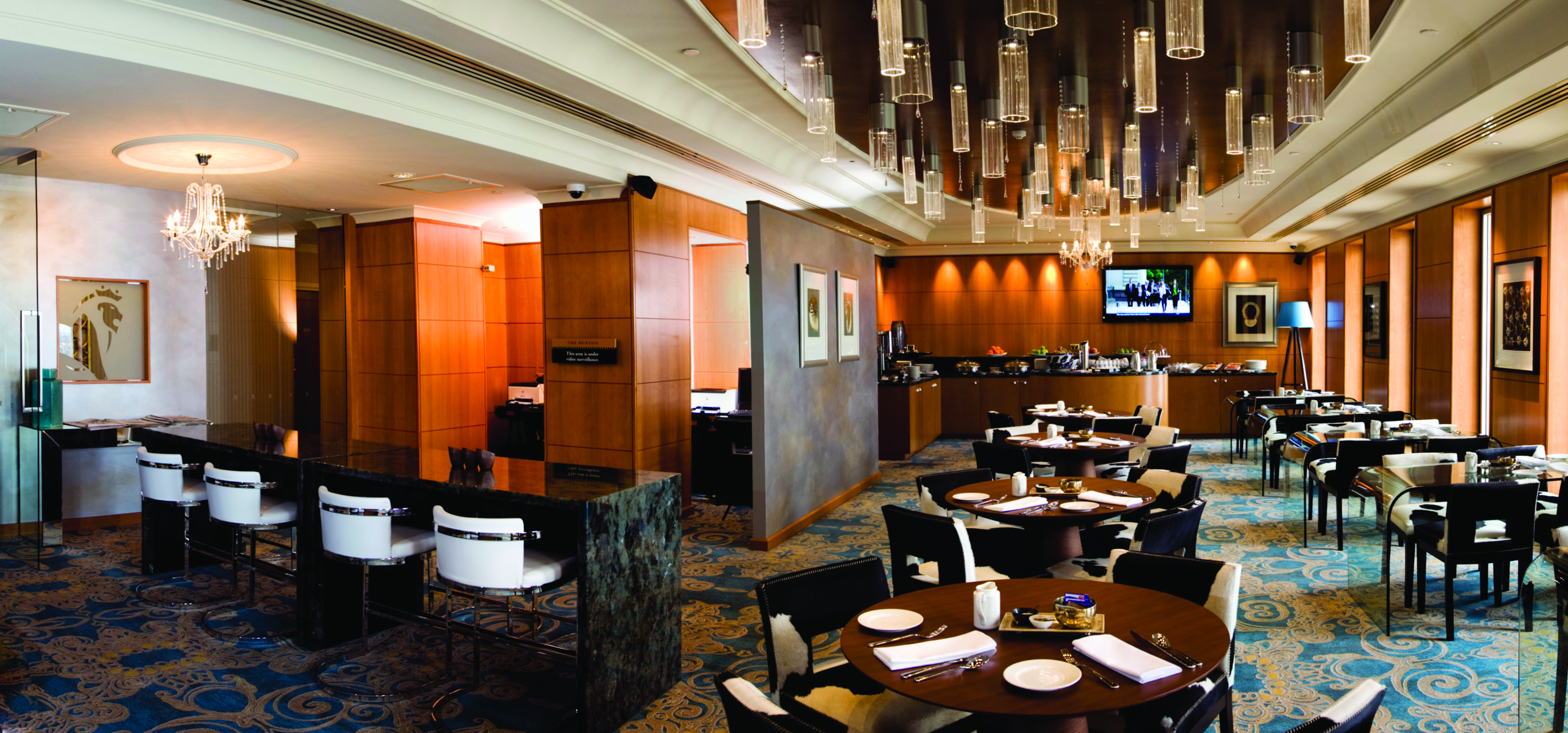 Duxton Hotel Western Australia and Perth lounge indoor dining area with patterned carpet