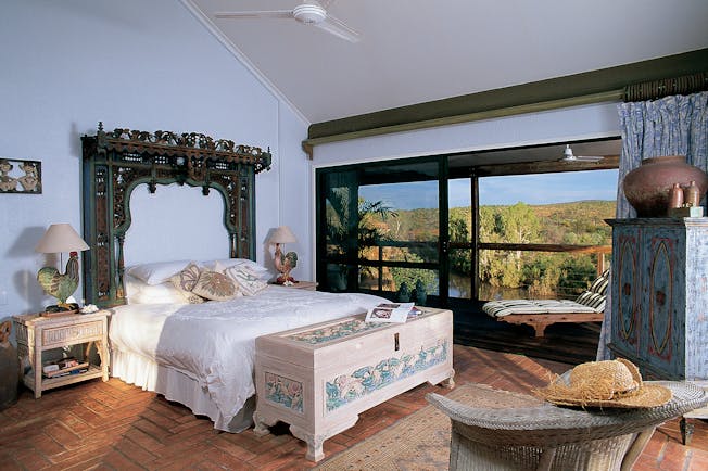 El Questro Western Australia bedroom with antique furniture and patio door to balcony 