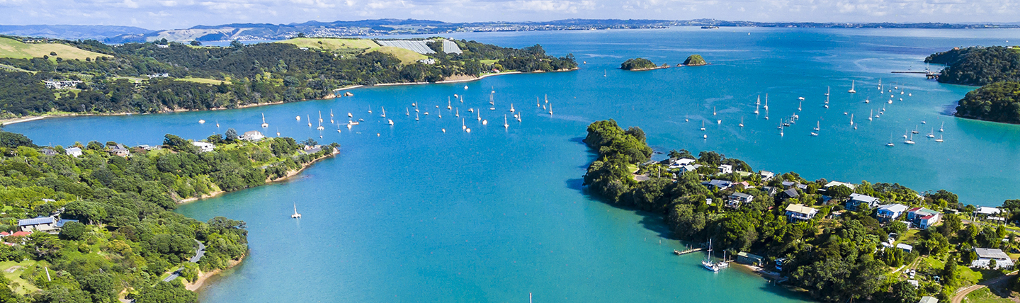 Wide estuary with blue sea and boats at Auckland NZ