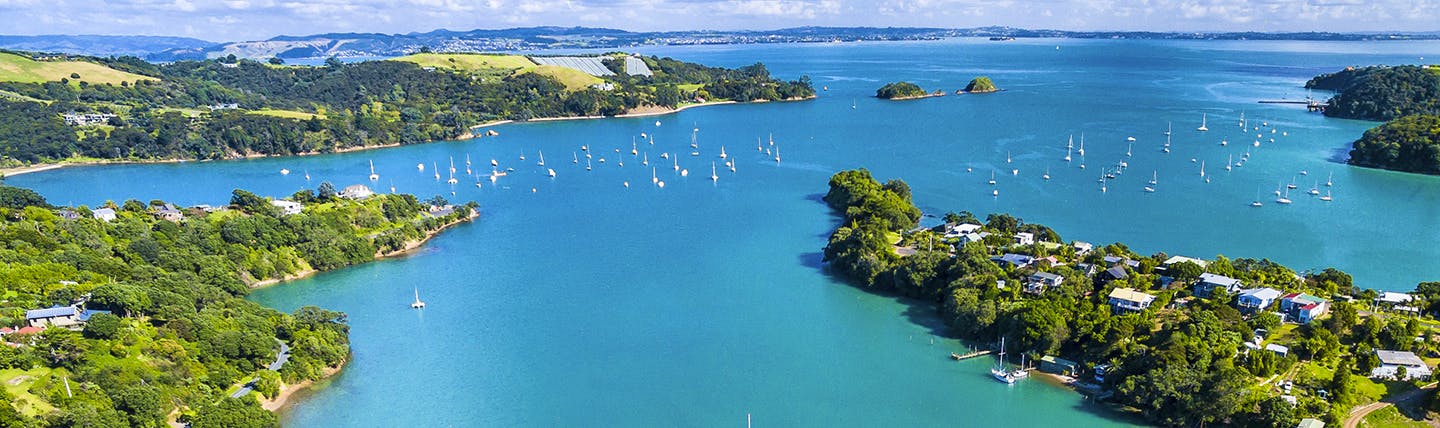 Wide estuary with blue sea and boats at Auckland NZ