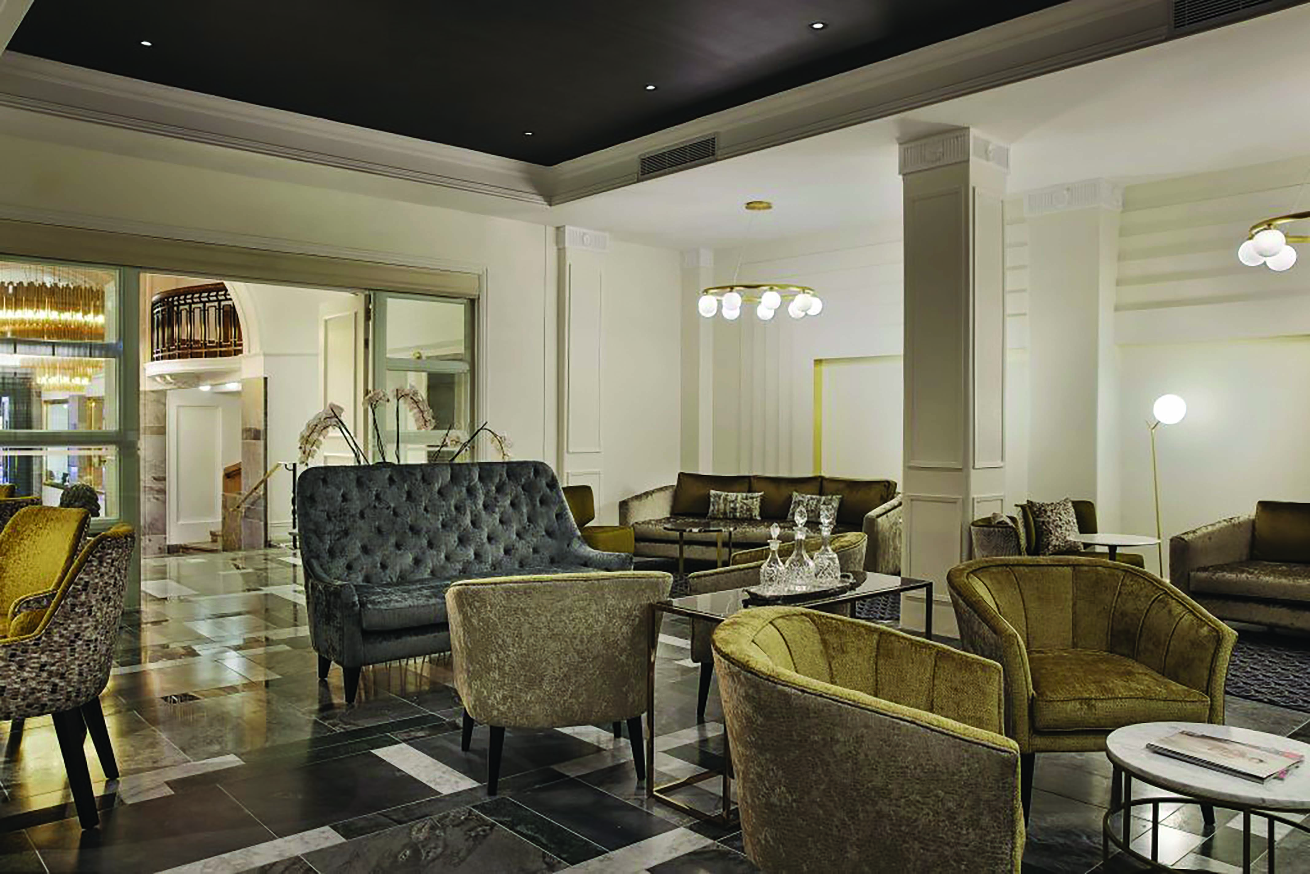 Hotel lobby at the Grand Hotel Windsor with velet armchairs and chandeliers