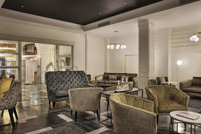 Hotel lobby at the Grand Hotel Windsor with velet armchairs and chandeliers