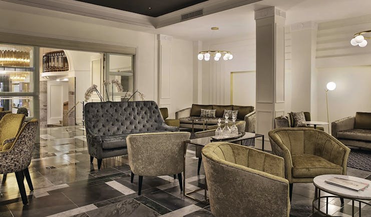 Hotel lobby at the Grand Hotel Windsor with velet armchairs and chandeliers