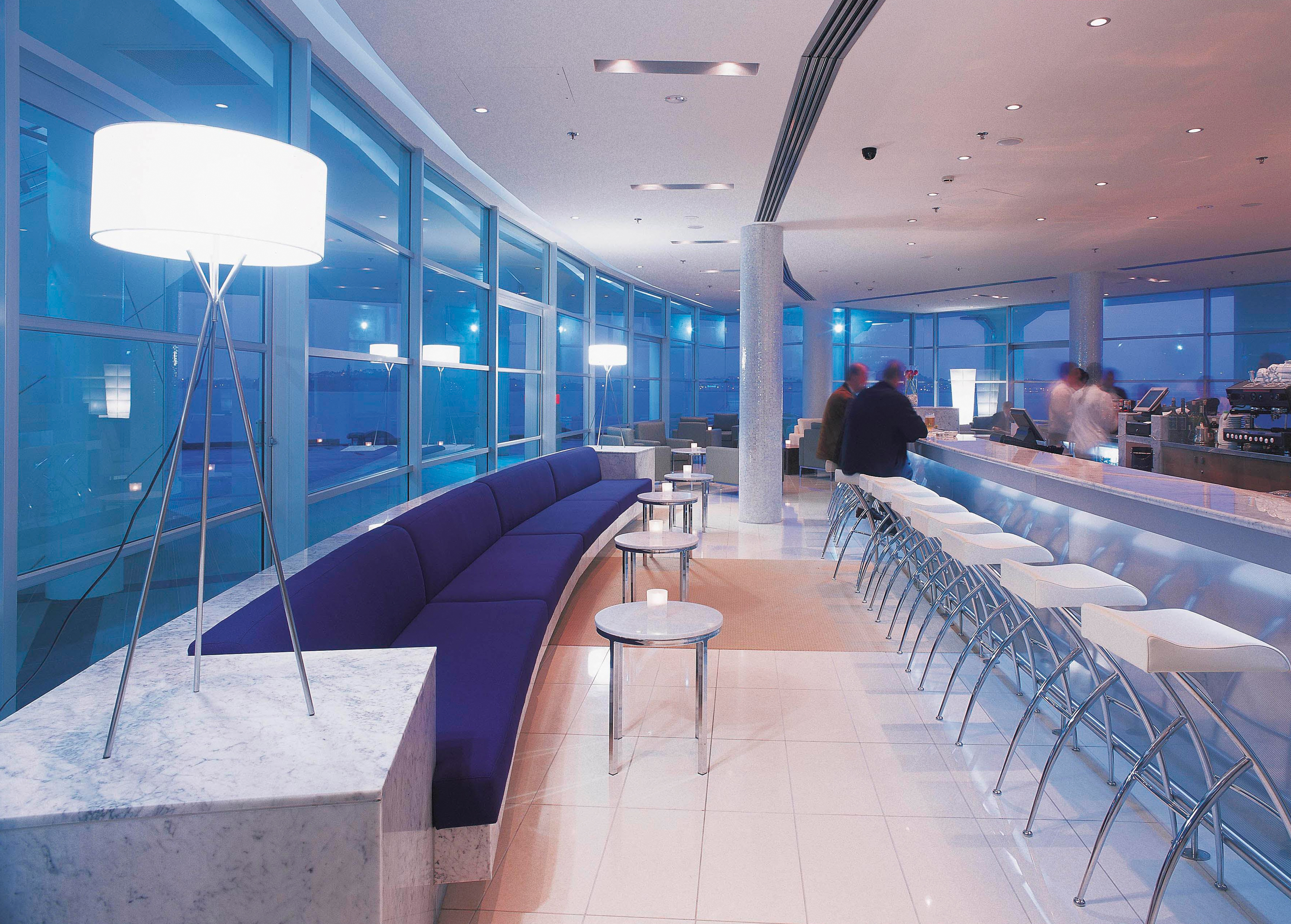 Bellini bar with white colour scheme, bar stools and sofas 