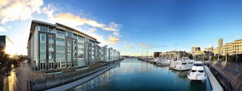 Sofitel Viaduct Auckland Harbour exterior glass fronted building next to marina