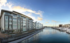 Sofitel Viaduct Auckland Harbour exterior glass fronted building next to marina