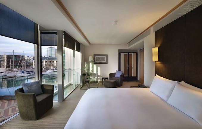 Sofitel Viaduct Auckland Harbour marina room bedroom with floor to ceiling windows and marina view